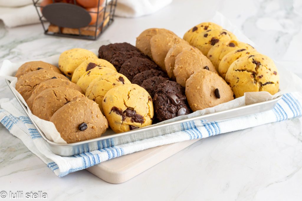 Assortment of gluten-free cookies with chocolate, cocoa and coffee variations on a white plate
