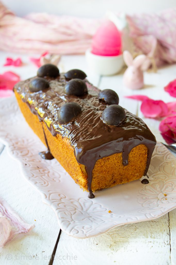 Plumcake with chocolate eggs and orange