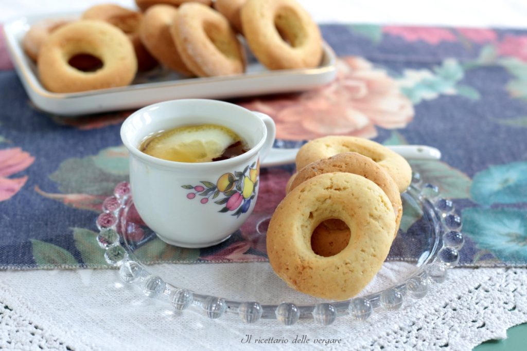 Tray of soft cream cookies without butter next to a cup of coffee