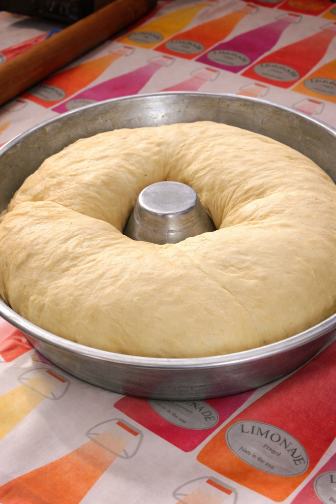Neapolitan tortano in the pan during the final rise before baking