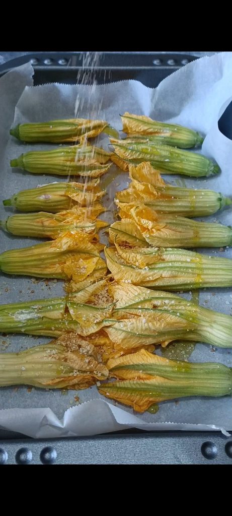 Wir vervollständigen mit Parmesan, Semmelbrösel und Öl