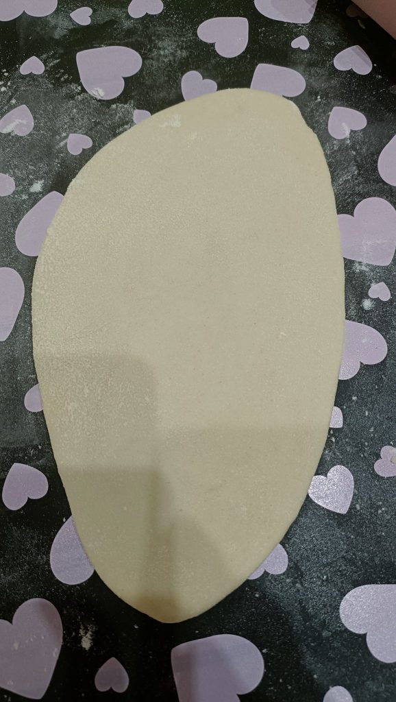 Boule étalée au rouleau à pâtisserie