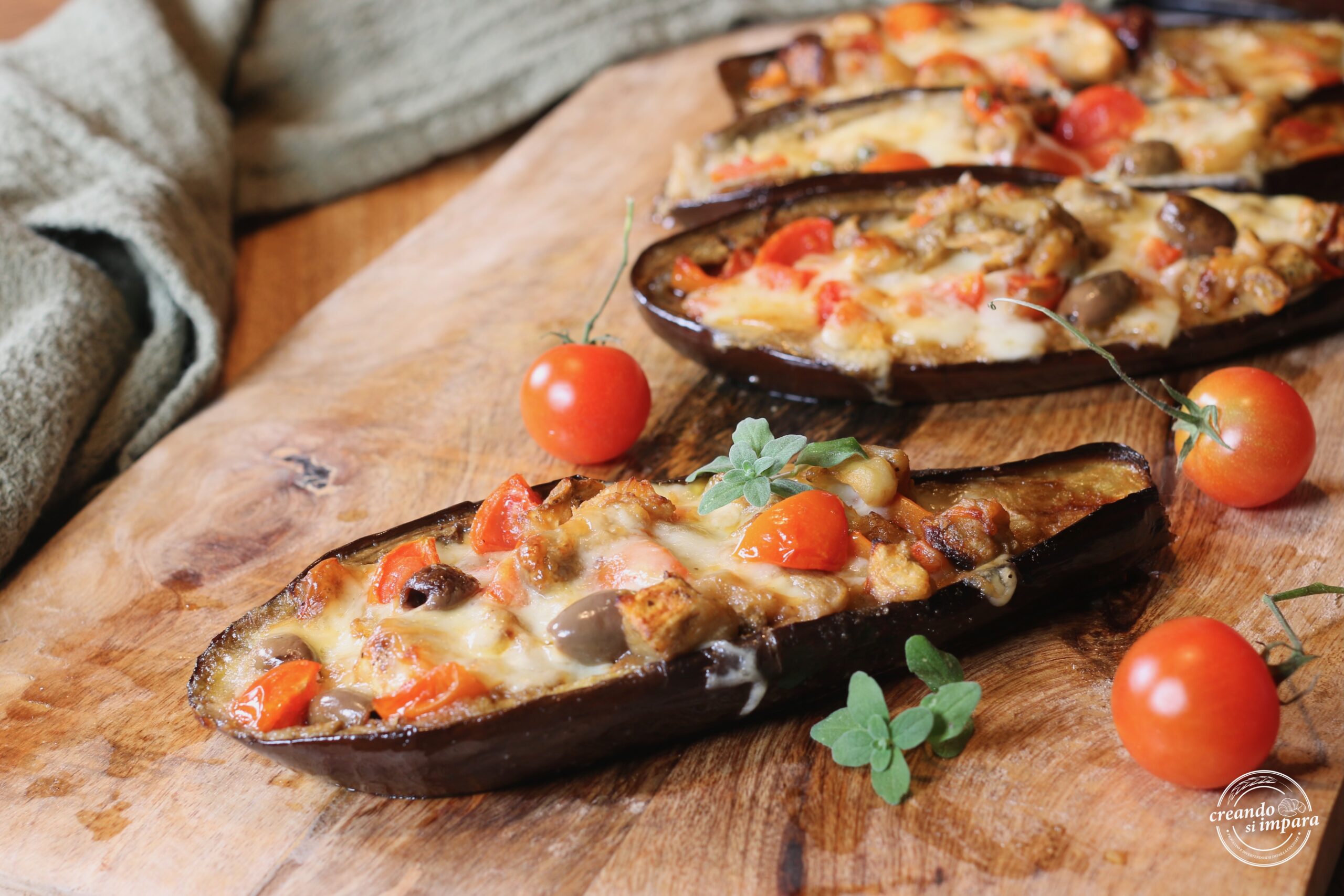 Aubergines farcies au fromage et aux tomates cerises