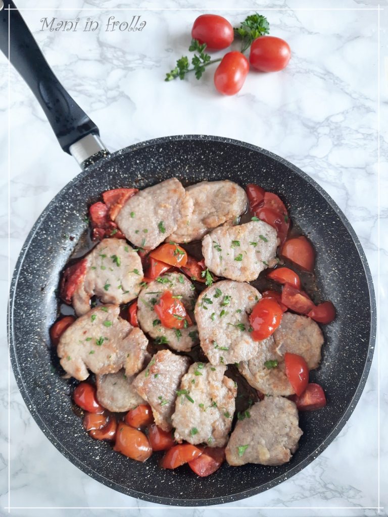 Fettine de cerdo con tomatitos