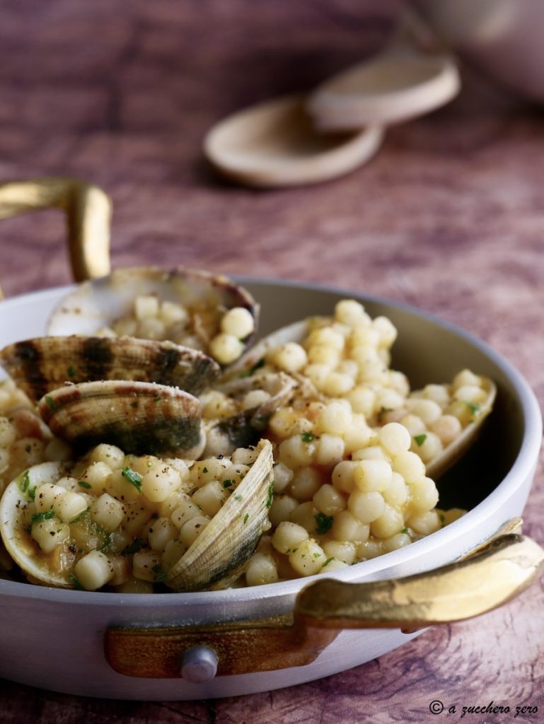 Fregola con almejas y calabaza