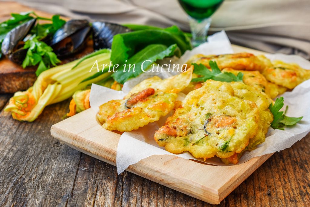 Buñuelos de mejillones y flores de calabacín