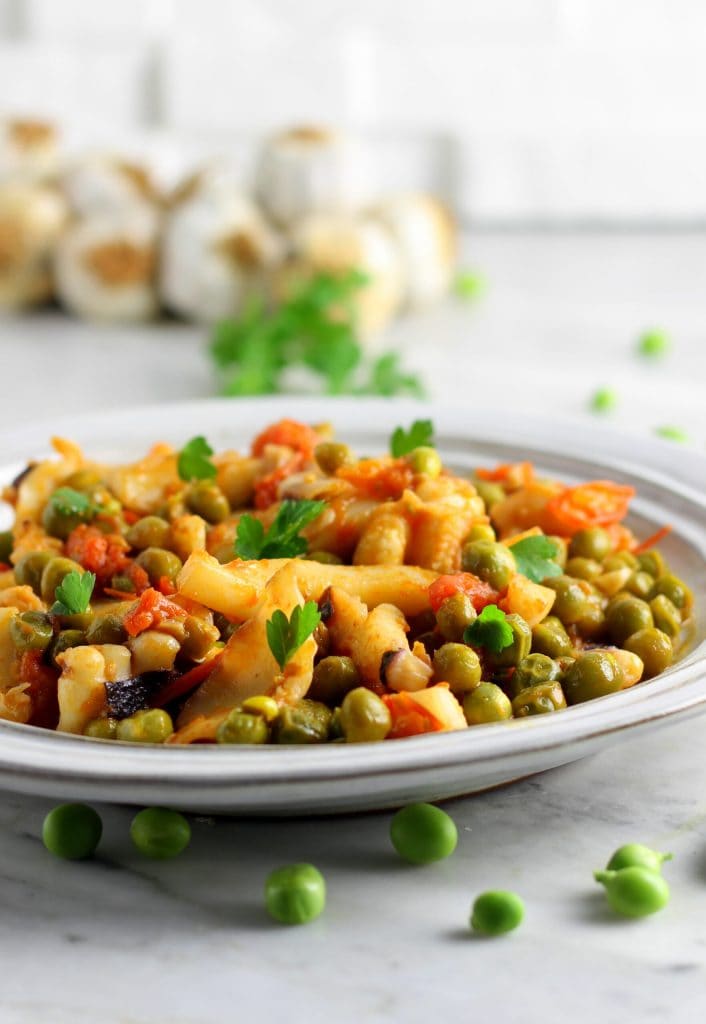 Sepias con guisantes y tomates cherry