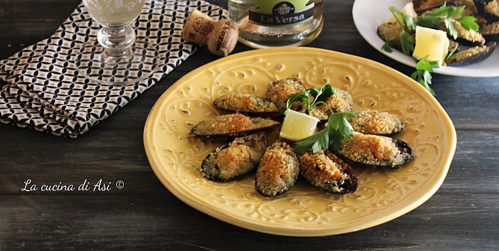 Mejillones rellenos y gratinados al horno