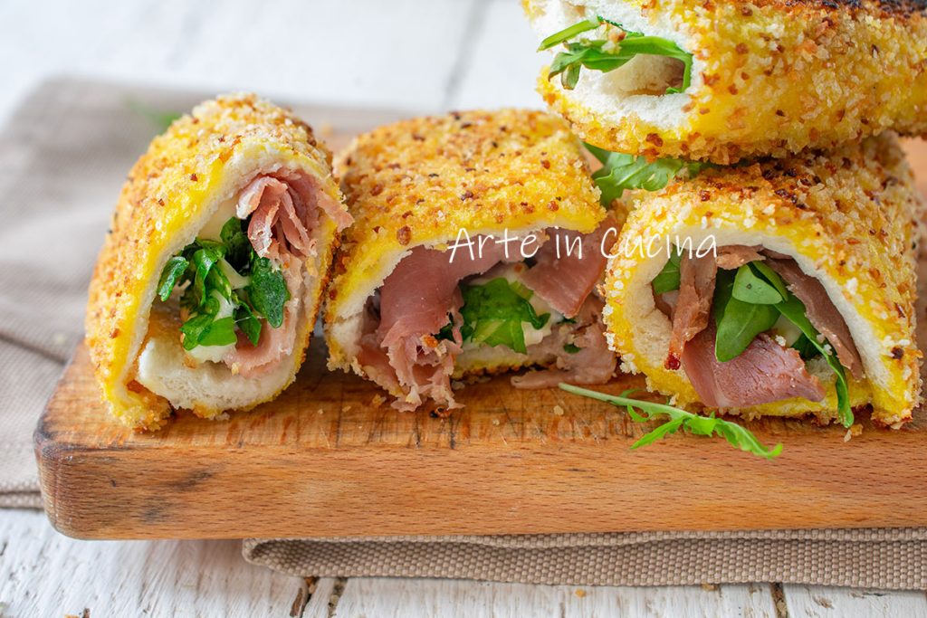 Cannoli de pan de molde speck y rúcula