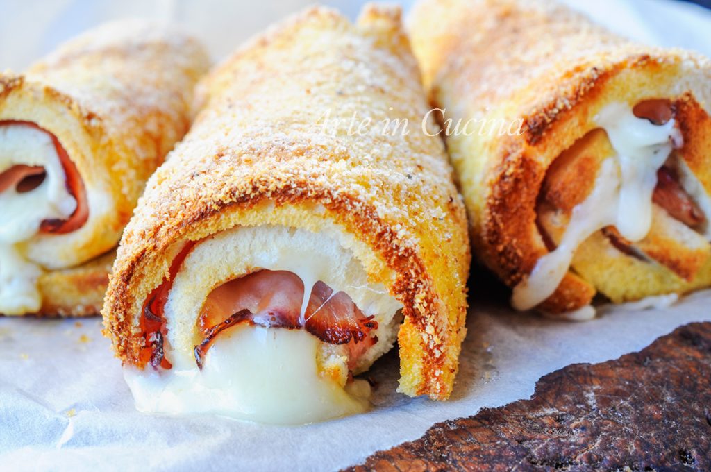 Cannoli de pan de molde jamón y queso al horno