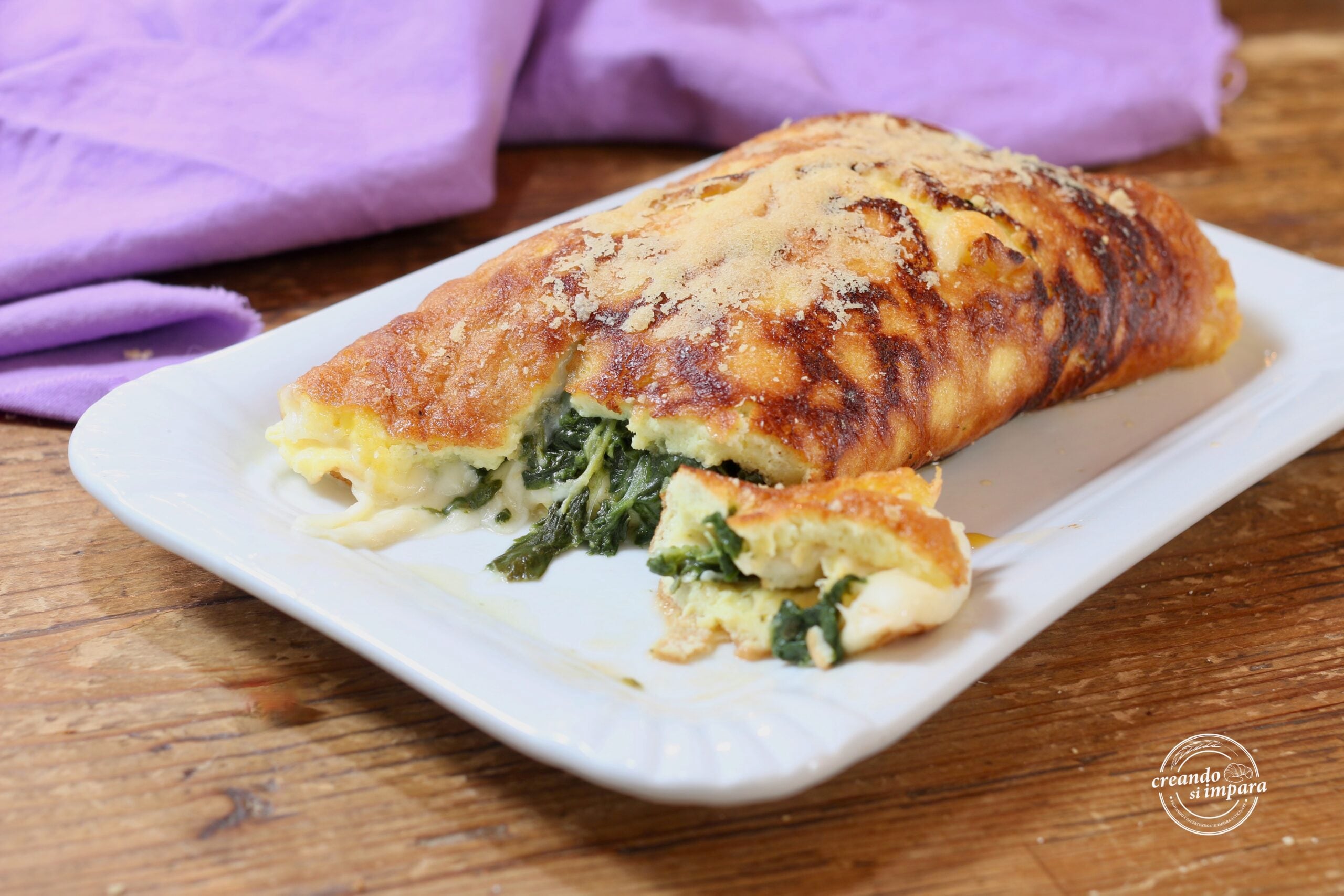 Omelete enrolado com espinafre e scamorza