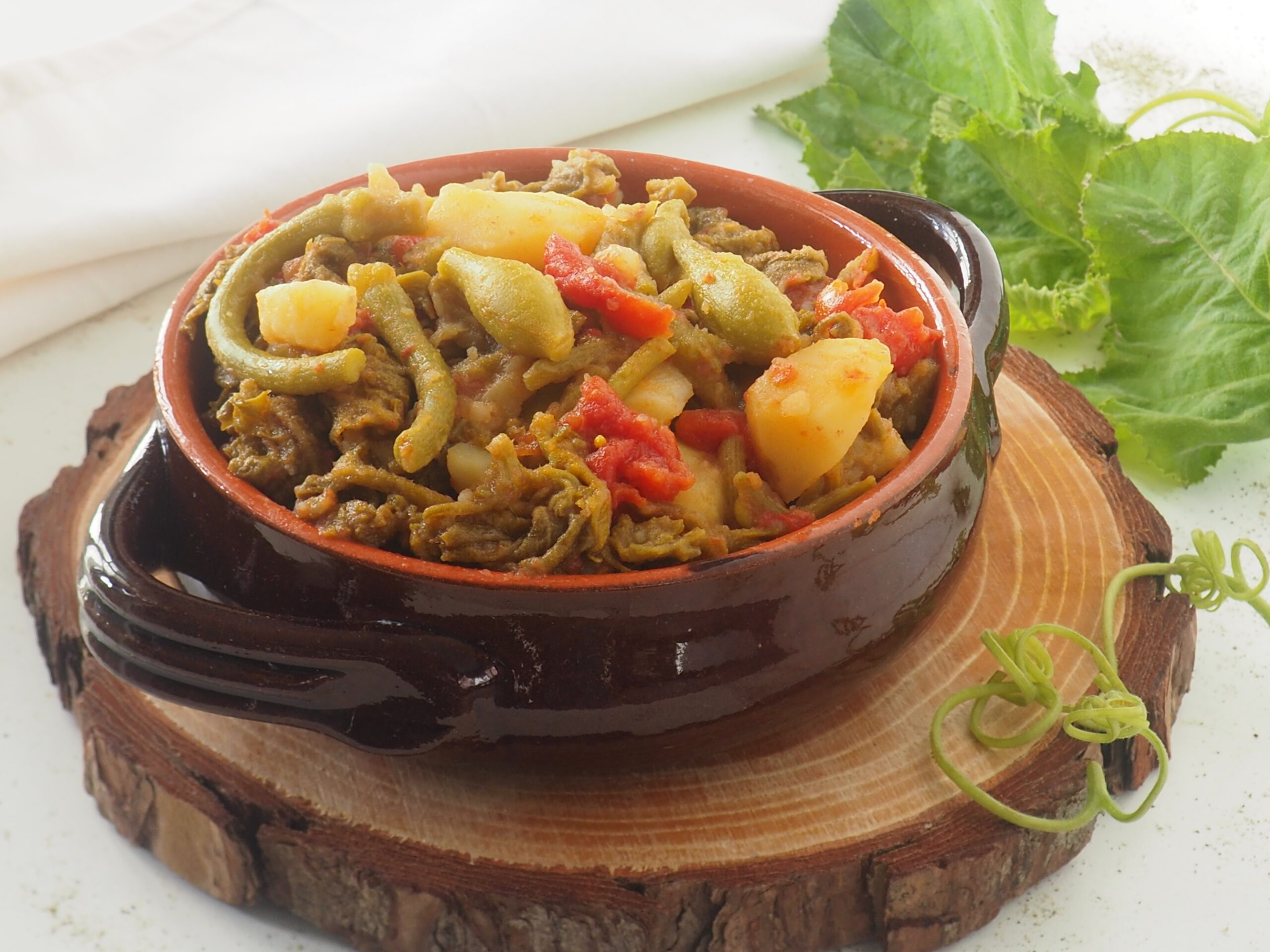 Talas (ou pontas) de abóbora com batatas e tomates pelados