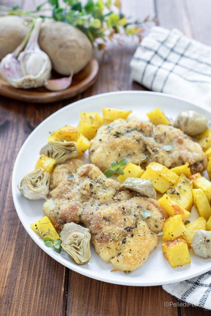 kip uit de oven met aardappelen en artisjokken