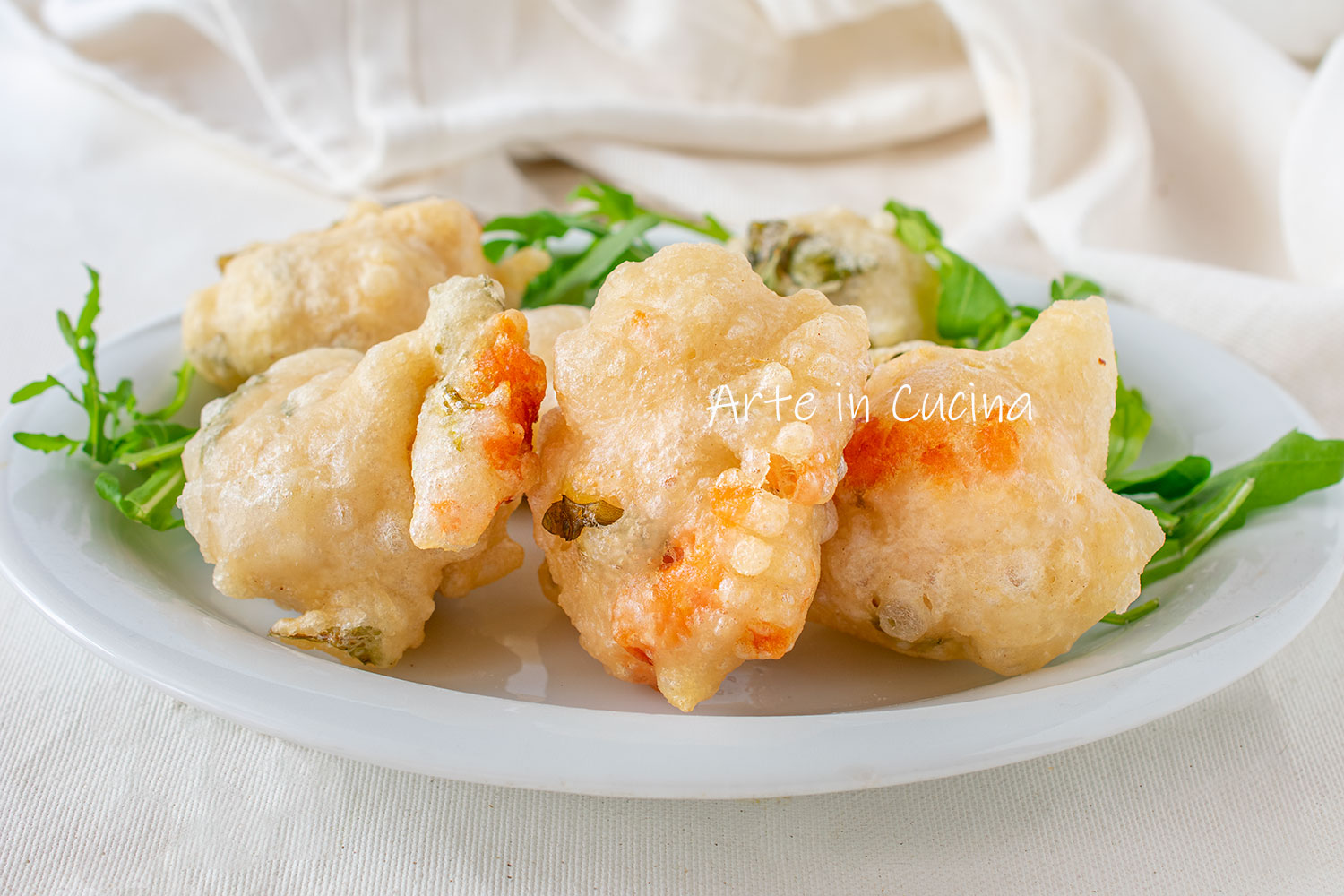 Zeppoline met zalm en rucola beignets