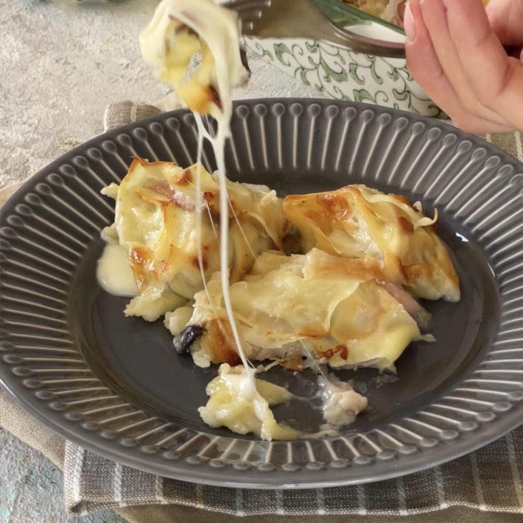 lasagnerolletjes met ham en champignons