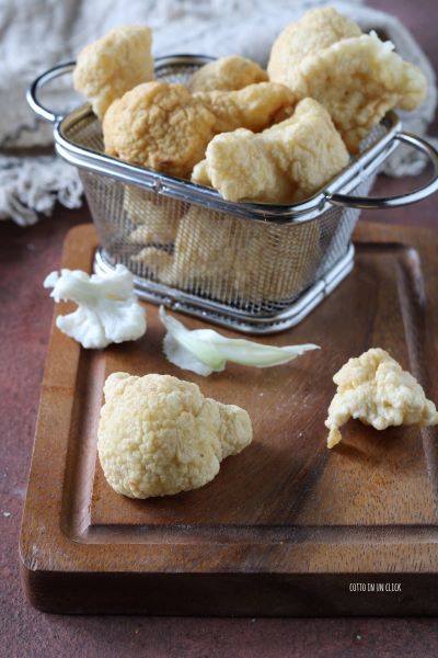 laat de beignets uitlekken op keukenpapier en serveer
